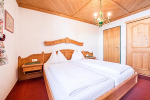 Postel nebo postele na pokoji v ubytování Haus am Platz - Weitgasser