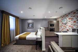 a hotel room with a bed and a tv at EPIC Apart Hotel - Seel Street in Liverpool