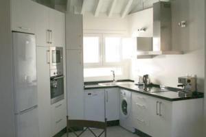 Kuchyň nebo kuchyňský kout v ubytování Apartamento Mar de Alborán