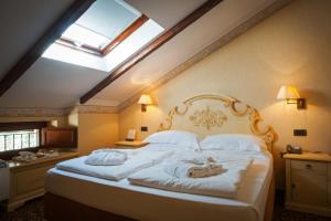 Postel nebo postele na pokoji v ubytování Relais Ducale Spa & Pool