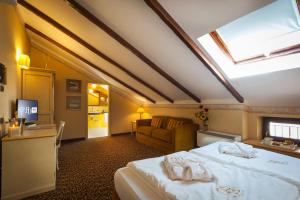Postel nebo postele na pokoji v ubytování Relais Ducale Spa & Pool