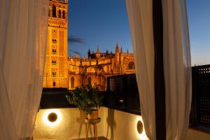 a view of the tower of london from a window at Welldone Cathedral in Seville