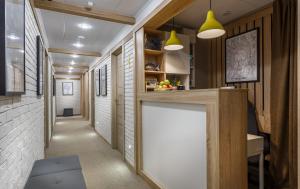 a hallway with a white counter in a room at Hotel Trips in Moscow