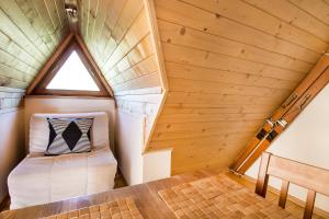 a room in a tiny house with a window at Apartament Olczanka Zakopane in Zakopane