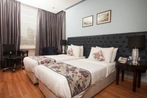 Cama o camas de una habitación en Hotel Athena