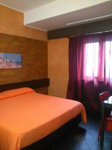 Abalon Pompei Resort客房内的一张或多张床位