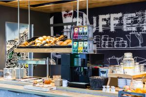 a bakery counter with bread and pastries on display at ibis Budget Knokke in Knokke-Heist