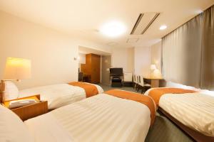 Postel nebo postele na pokoji v ubytování Fuji Green Hotel + 37 fotografií