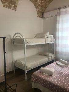 Postel nebo postele na pokoji v ubytování Il Torrione
