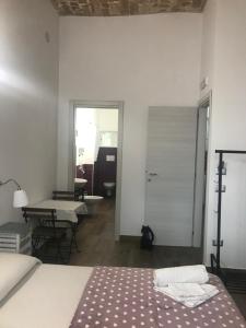 Postel nebo postele na pokoji v ubytování Il Torrione