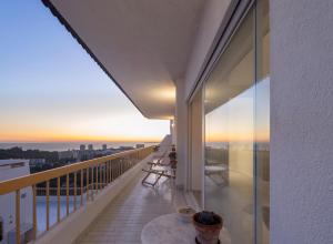 a balcony with a view of the ocean at LUXURY ALVOR PENTHOUSE in Alvor
