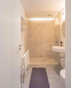 a bathroom with a shower and a sink at LUXURY ALVOR PENTHOUSE in Alvor