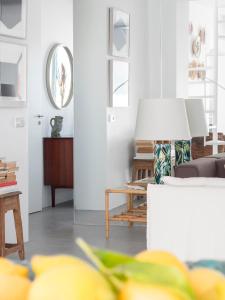 a living room with a couch and a table at LUXURY ALVOR PENTHOUSE in Alvor