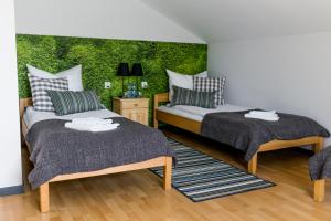 Ένα ή περισσότερα κρεβάτια σε δωμάτιο στο Stadnina koni Leśna Wola