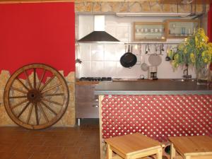 a kitchen with a woodenoked wheel in a kitchen at LASAILEKU in Bilbao