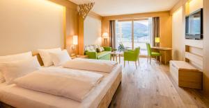 Postel nebo postele na pokoji v ubytování Hotel Hasslhof + 37 fotografií