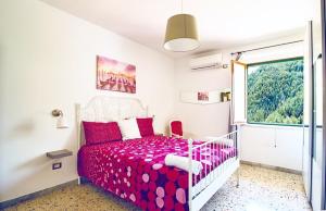 Ένα ή περισσότερα κρεβάτια σε δωμάτιο στο Casa Maria