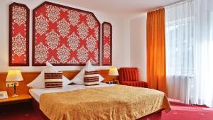 Postel nebo postele na pokoji v ubytování Hotel Neckarlux