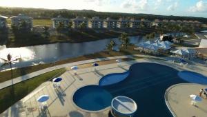 an aerial view of a swimming pool at a resort at Apartamento Condomínio Villa das Águas in Praia do Saco