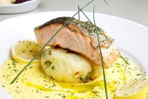 a plate of food with a piece of meat and potatoes at The Rusty Mackerel in Teelin