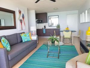 a living room with a couch and a table at Marbella del Caribe 805 in San Juan