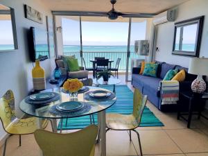 a living room with a table and chairs at Marbella del Caribe 805 in San Juan