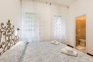 Posteľ alebo postele v izbe v ubytovaní Rampolina view by Impero House