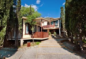 a house with a staircase leading up to it at Zeleny Mis in Alupka