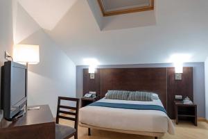 Postel nebo postele na pokoji v ubytování Hotel Alda Cardeña
