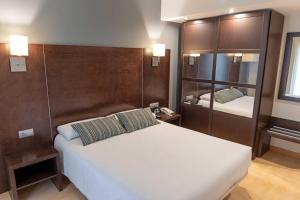 Postel nebo postele na pokoji v ubytování Hotel Alda Cardeña