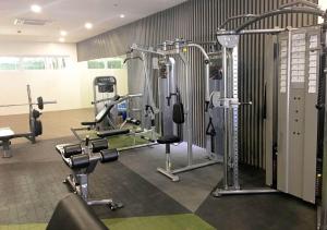 a gym with several tread machines and weights at EV Place in Manila