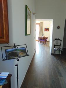 a living room with a painting on the wall at La corte di Bafè B&B "Slow Life" in Zafferana Etnea