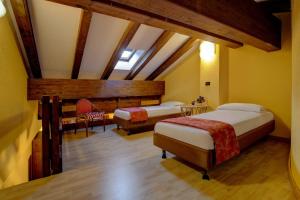 Postel nebo postele na pokoji v ubytování iH Hotels Courmayeur Mont Blanc