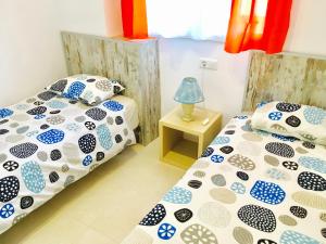 Apartment Aguila Real 2 tesisinde bir odada yatak veya yataklar
