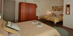 Giường trong phòng chung tại Albergo Alla Valle di Banne