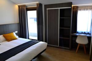Cama o camas de una habitación en Hotel Alda Estación Ourense