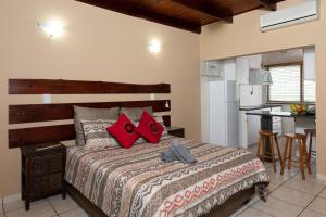 A bed or beds in a room at Manzini Chalets