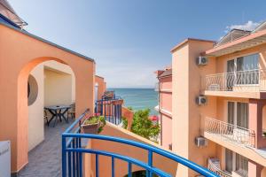 an apartment balcony with a view of the ocean at Hotel Evridika in Nesebar