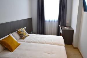 Cama o camas de una habitación en Hotel Alda Estación Ourense