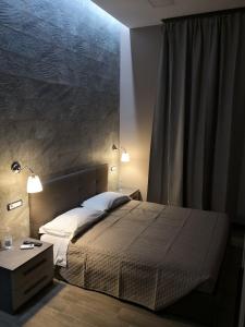 A bed or beds in a room at City Break Nomentana