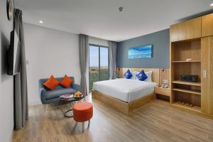 Giường trong phòng chung tại Jolia's House Da Nang Beach