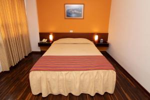 Cama o camas de una habitación en Hotel Chavín