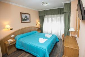 Voodi või voodid majutusasutuse Hotel PAYRO ** toas