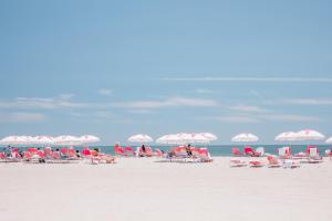 a group of chairs and umbrellas on a beach at Congress Hall in Cape May
