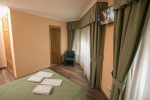 Postel nebo postele na pokoji v ubytování Hotel PAYRO