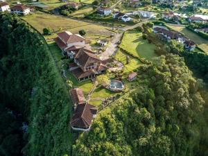 an aerial view of a house on a hill at Hacienda Los Molinos Boutique Hotel & Villas in Boquete