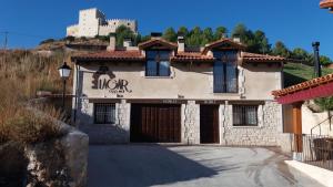 a building with a sign on the side of it at Lagar II con Jacuzzi in Curiel de Duero