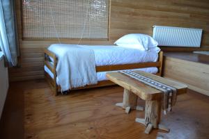 Voodi või voodid majutusasutuse Refugio Pullao toas