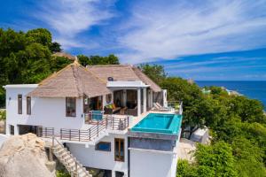 an aerial view of a house with a swimming pool at Villas Sabai Jai in Koh Tao