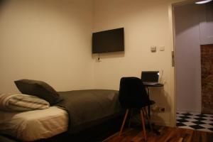 Televízia a/alebo spoločenská miestnosť v ubytovaní St. Dorothys hostel - apartments